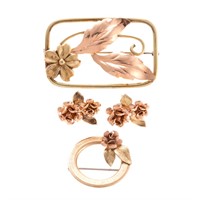 A Collection of Tri Gold Flower Jewelry