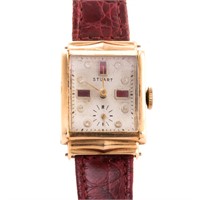 A Lady's Stuart Ruby & Diamond Wrist Watch in Gold