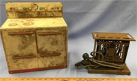 Child's metal stove, and an antique metal toaster