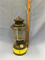 Old kerosene lamp, green, has container with spare