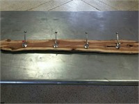 Wood with coat hangers on it