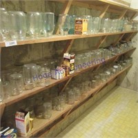 3 shelves jars assorted sizes some blue
