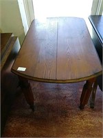 Antique dining room table on rollers