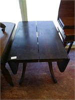 Antique dining room table with fold down sides
