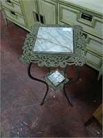 Metal accent table with marble inlays