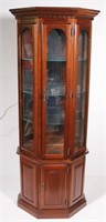 cherry lighted mirrored back curio cabinet with