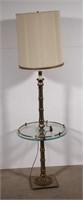 glass and brass tone floor light end table,