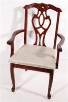 pierced back arm chair, 38.75" tall x 25" wide x