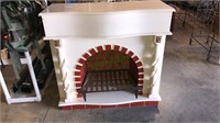 Faux fireplace with cast-iron wood grate insert,
