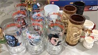 8 Star Trek glasses, 4 Santa cups, 3 Tiki mugs,