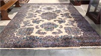 Room size rug with a cream background, 144 x 108,