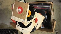 Large box of 45 RPM records with lots of sleeves,