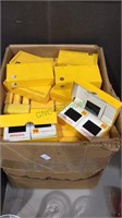 about 100 small boxes Kodak developed slides,