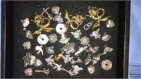 Group of Silvertone charms and some brass mermaid