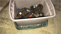 Small tub with a lid full of tools including a