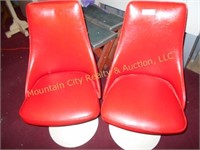 Two Red Swivel Chairs