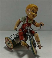 Tin toy wind-up bicycle
