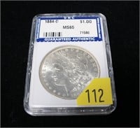 1884-O Morgan dollar, slab certified MS-65