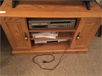 TV stand with 2 tape and DVD players.