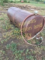 Fuel tank, 500-gallon, sets on ground, rust color