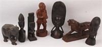 7 CARVED WOODEN STATUES