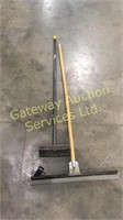 Floor squeegee and a brush