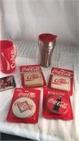 Factory sealed Coca-Cola coasters plus aluminum