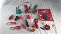 Large collection of coke key chains, pins and