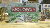 MONOPOLY GAME NEW IN BOX HAS MOST OF THE WRAPPING