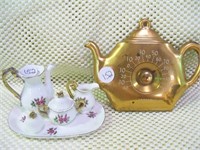 Lady figurines & miniature tea set