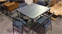 Folding table and four chairs used