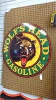 Wolfs head gasoline round metal sign