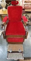 ANTIQUE RED FABRIC AND WOOD BARBERS CHAIR BY KOKEN