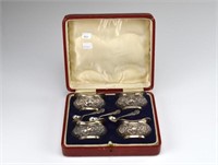 Four Edwardian silver salts with three spoons