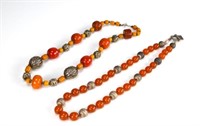 Two long amber bead necklaces