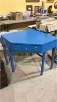 Solid wood painted bright blue one drawer corner