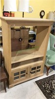 Oak flat screen TV stand with two doors below and