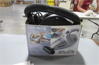 "The Shark" handheld vacuum