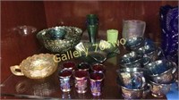 Large selection of carnival glass serving