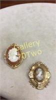 Pair of antique gold toned cameo brooches