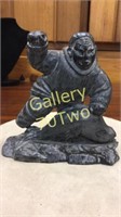 Black stone Fisherman with whale sculpture