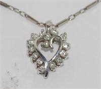 White 9ct gold and diamond heart shape pendant