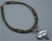 Sterling silver pendant on a silk choker