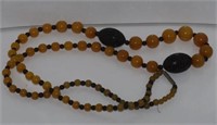 String of graduated amber style beads