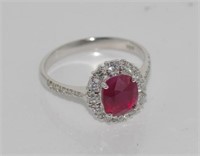 Good oval ruby & diamond cluster ring