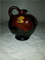 Beautiful Pitcher featuring and embossed male