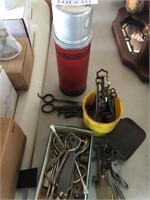 Vintage keys, bottle openers, and thermos.