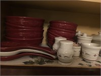Longaberger Pottery serving pieces by the shelf.