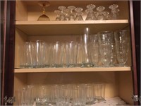Cupboard containing a variety of glasses.