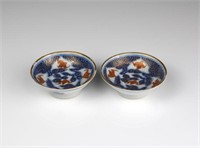 PAIR OF CHINESE CORAL RED ON BLUE & WHITE DISHES